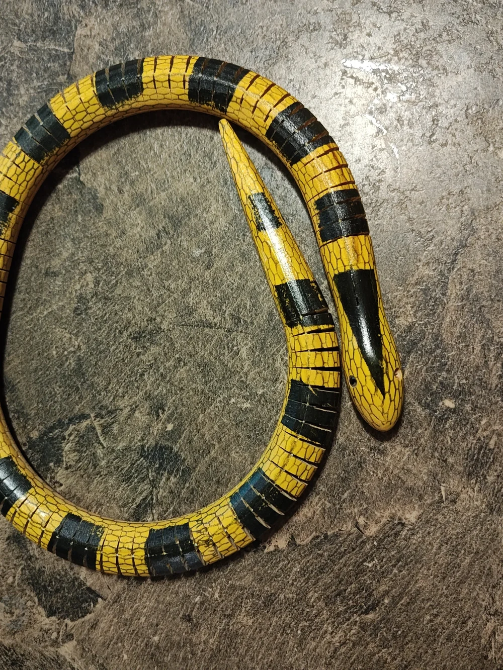 Yellow and Black Reptile Wooden Snake